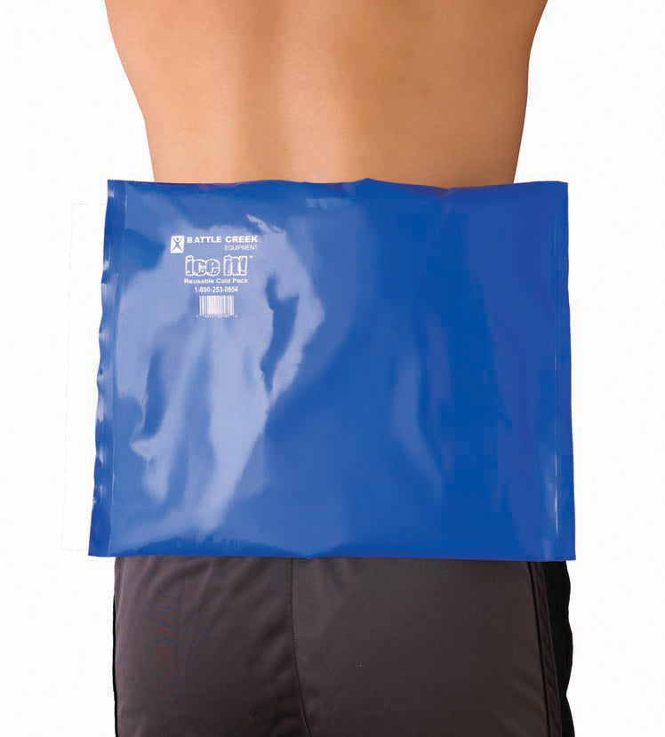 photo of a large blue pad laying on a persons back,  writing on the pad says Battle creek Ice it 